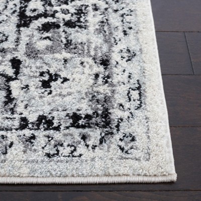 Ivory and Black Rectangular Synthetic Area Rug