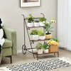 Tangkula 3-Tier Metal Plant Stand Ladder Shaped Flower Pot Holder Storage Rack w/ Wheels - 2 of 4