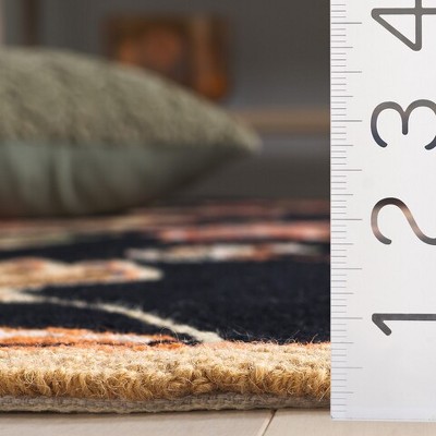 Handmade Black and Orange Floral Wool Area Rug