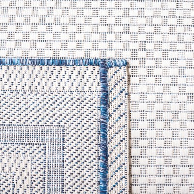 Ivory and Navy Rectangular Synthetic Indoor/Outdoor Rug