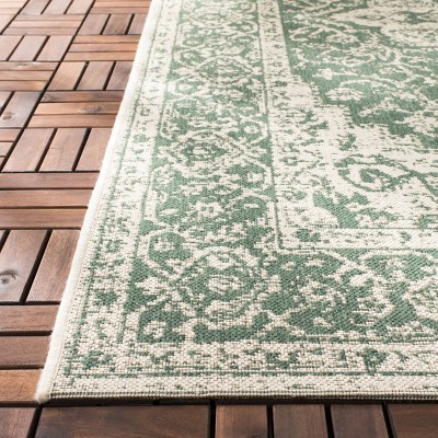 Green and Creme Medallion Synthetic 9' x 12' Tufted Area Rug