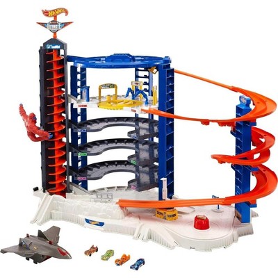 Hot Wheels Toy Car Track Set & 4 1:64 Scale Cars, Super Ultimate Garage, 3+ ft Tall Storage for 140 Cars