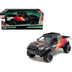 2023 Toyota Tacoma TRD PRO Off Road Truck Matt Black with Graphics and Roofrack 1/27 Diecast Model Car by Maisto - 1 of 4