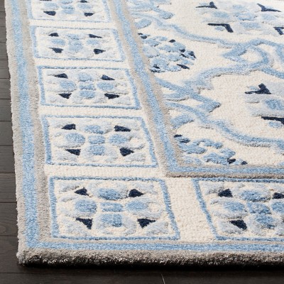 Handmade Ivory and Blue Wool Viscose Tufted Area Rug