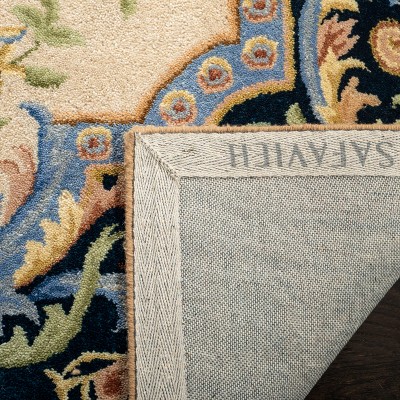 Ivory and Navy Handmade Wool Floral Area Rug