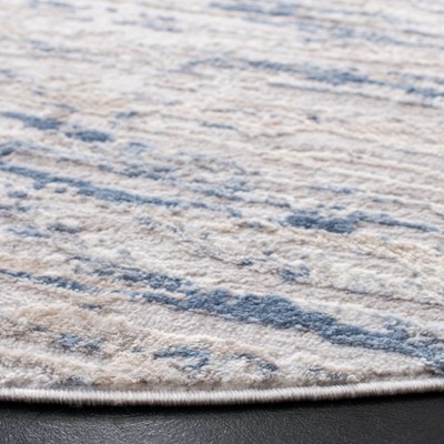 Amelia Ivory and Blue Round Synthetic Area Rug