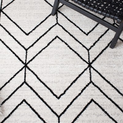 Ivory and Black Geometric 8' x 10' Synthetic Area Rug