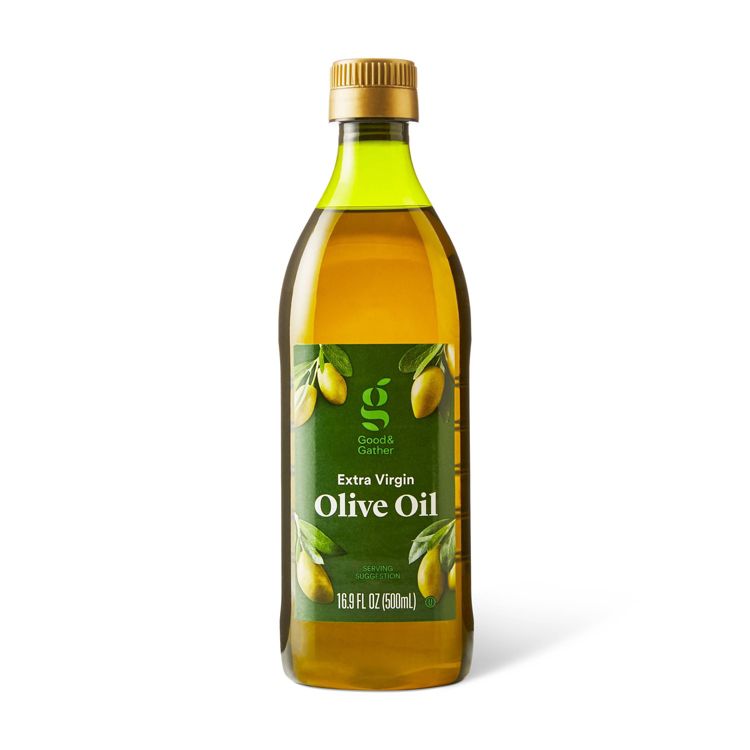 A bottle of Good & Gather Extra Virgin Olive Oil with a green label showing olives, marked 16.9 FL OZ (500 mL).