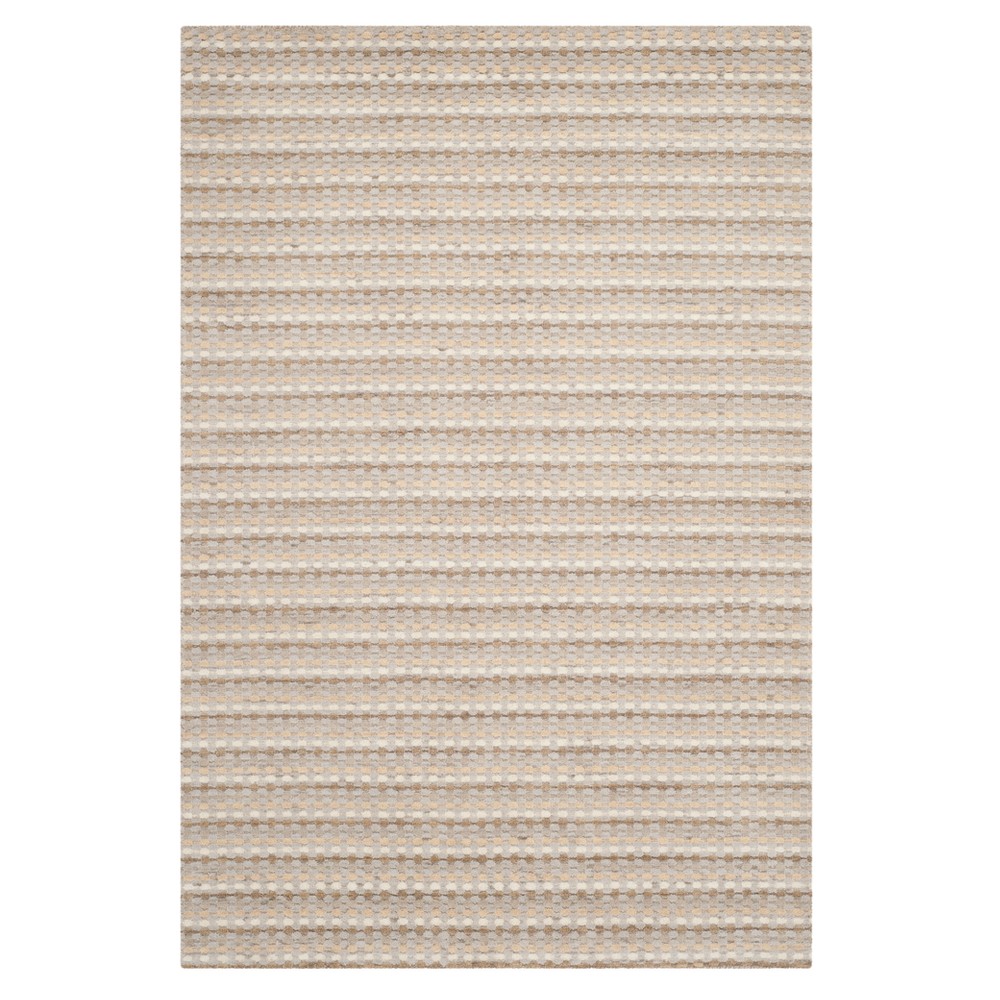 Beige Stripe Loomed Area Rug  - Safavieh The casual allure of contemporary Tibetan carpets is recalled in the texture rich rugs of the striped loomed area rug collection. Hand-loomed in India using 100percent pure wool in a myriad of heathered solids, Himalaya rugs are soft to the touch, easy to style, and an ideal addition for bedrooms and living rooms. As a timeless design blending traditional and modern style, each rug in this versatile collection is the ideal complement to mod, boho, or transitional styled home decor. Size: 5'X8'. Color: One Color.