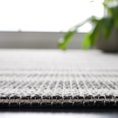 Ivory and Black Striped Synthetic 8' x 10' Area Rug