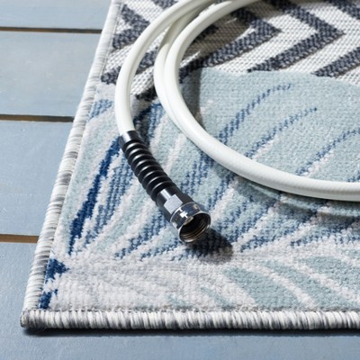 Ivory and Navy Geometric Synthetic 4' x 6' Area Rug