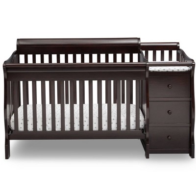 dark wood crib with changing table