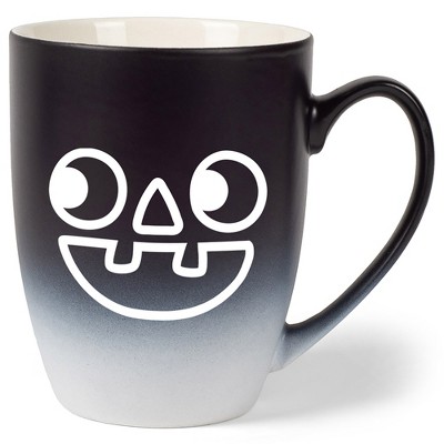 Elanze Designs Pumpkin Face Two Toned Ombre Matte Black and White 12 ounce Ceramic Stoneware Coffee Cup Mug