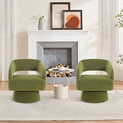 Two green swivel barrel chairs in living room with fireplace