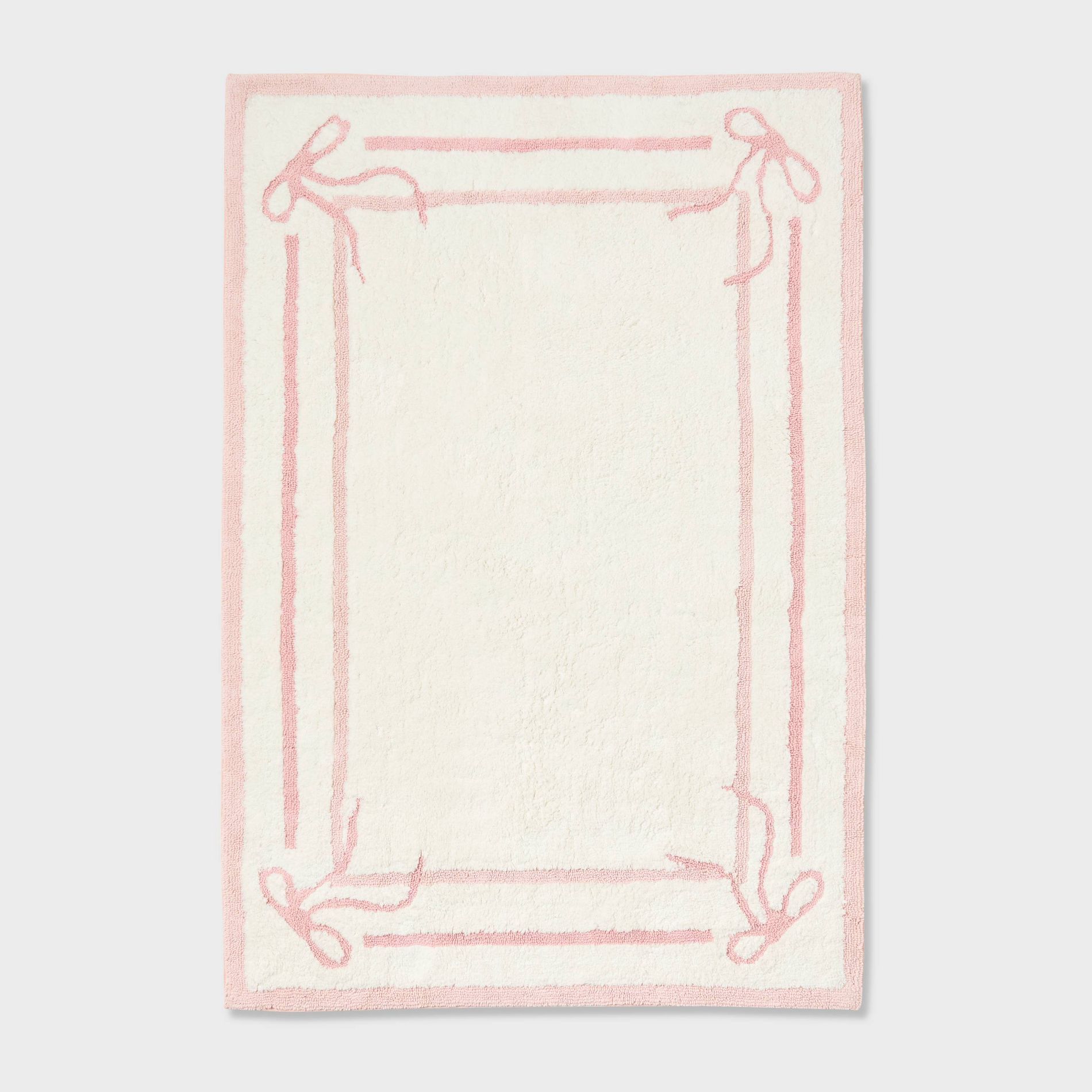 4'x5'6" Bow Border Kids' Area Rug Pink - Pillowfort™