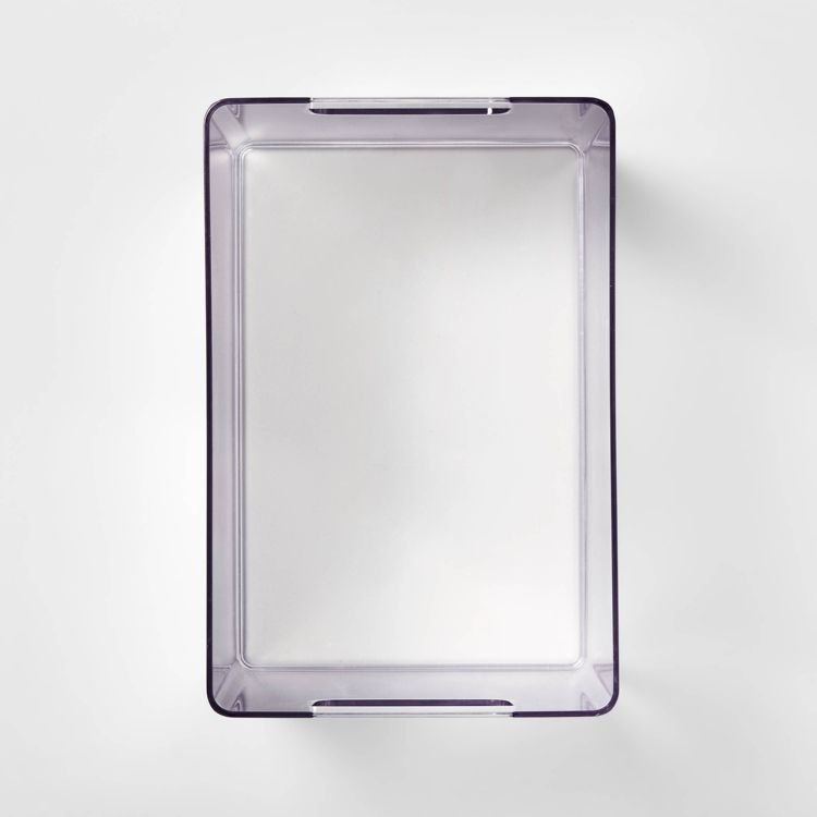 A rectangular clear colored bathroom tray with slightly raised edges.