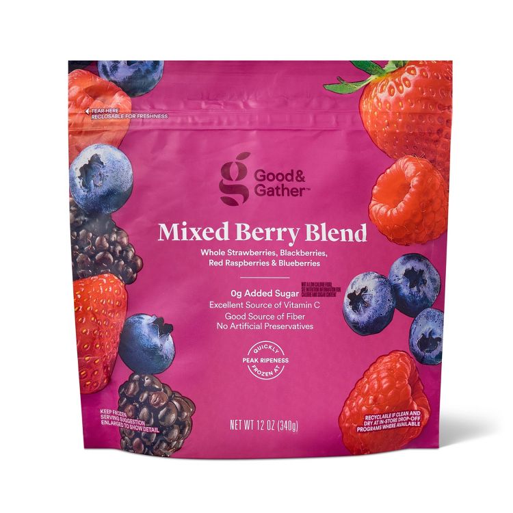 A pink colored package of Good & Gather Mixed Berry Blend featuring images of strawberries, blackberries, raspberries, and blueberries, with text highlighting 0g added sugar and vitamin C content.