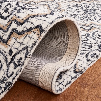 Ivory and Navy Tufted Wool Abstract Area Rug