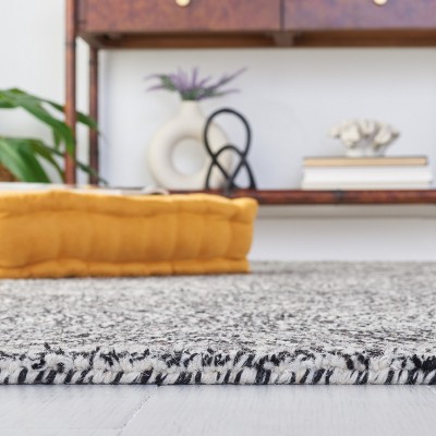 Handmade Black and Ivory Wool Tufted Area Rug, 5' x 8'