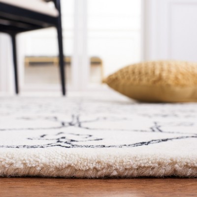 Ivory and Black Floral Hand-Tufted Wool Area Rug 4' x 6'