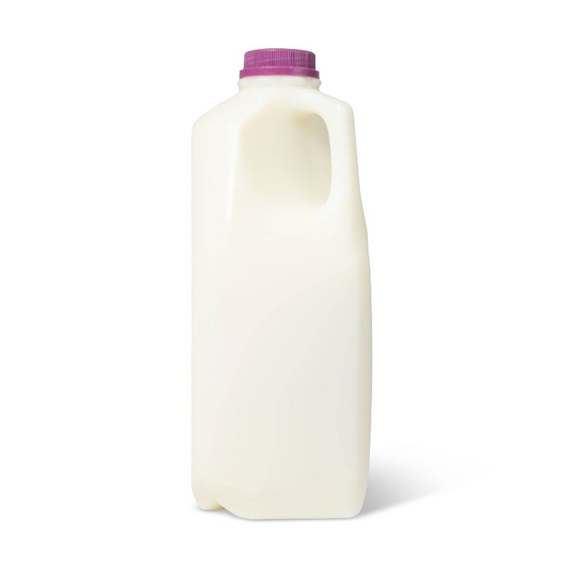 A white plastic milk jug with a purple colored cap.