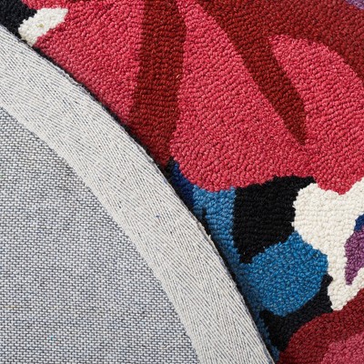Handmade Chelsea Floral Black Wool Oval Rug - 4' x 6'