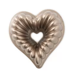 A beautiful clean white elegantly designed heart shaped silver on porcelin.