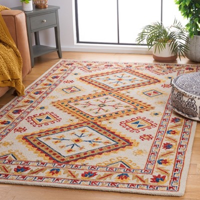 Handmade Ivory Wool Square Tufted Area Rug - 5' x 8'