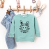 The Juniper Shop Don't Worry Be Hoppy Smiley Bunny Toddler Graphic Sweatshirt - 2 of 2