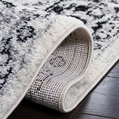 Ivory and Black Synthetic Round Area Rug
