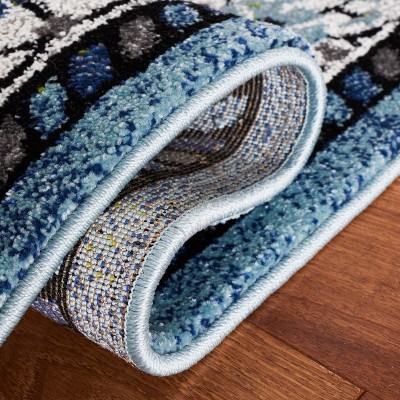 Blue and Ivory Synthetic Persian Area Rug, 5'3" x 7'6"