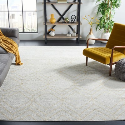 Ivory and Gold Geometric 9' x 12' Synthetic Area Rug
