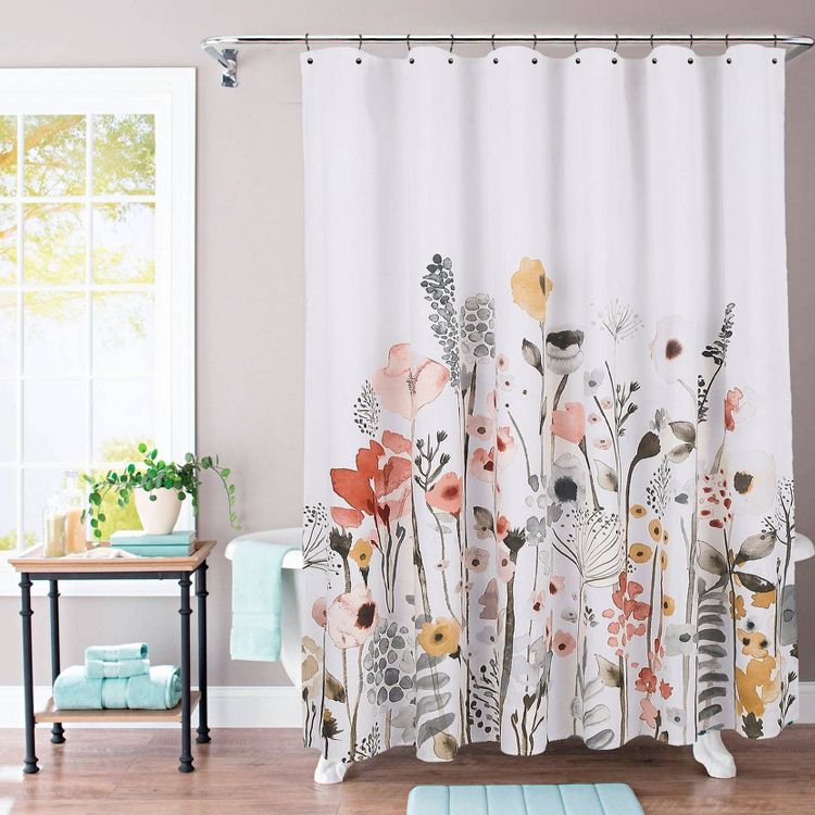 A white shower curtain with a colorful floral design featuring red, pink, yellow, and gray flowers.
