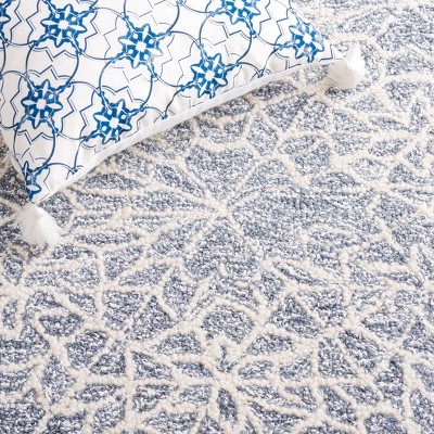 Ivory and Blue Handmade Wool Tufted 6' x 9' Abstract Rug