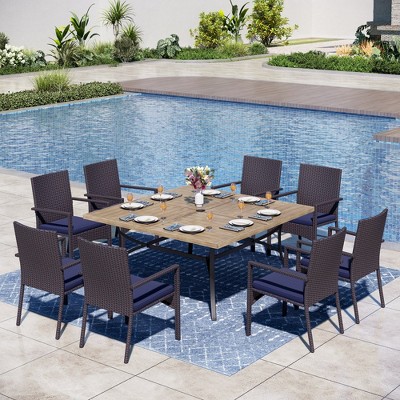 Captiva Designs 9pc Spacious Slat-top Square Metal Table with Umbrella Hole & Armrest Rattan Chairs with Blue Cushions