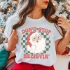 Simply Sage Market Women's Don't Stop Believin' Santa Checkered Short Sleeve Garment Dyed Tee - 2 of 4