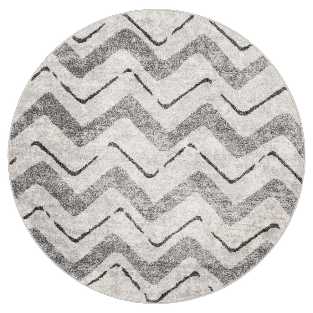 6'x6' Round Briarwood Adirondack Area Rug Silver/Charcoal Round - Safavieh Inspired by global travel, the bold colorful motifs and alluring patterns, Briarwood Adirondack Area Rugs translate rustic lodge style into supremely chic, easy-care floor coverings. Made using enhanced polypropylene yarns, Briarwood rugs explore stylish over-dye and antiqued looks, making a striking fashion statement in any room. Safavieh translates rustic lodge style into the supremely chic and easy-care collection. The Briarwood Collection is power loomed using soft yet durable enhanced polypropylene yarns for a comforting feel underfoot and lasting beauty.   Size: 6' ROUND. Color: One Color. Pattern: Chevron.