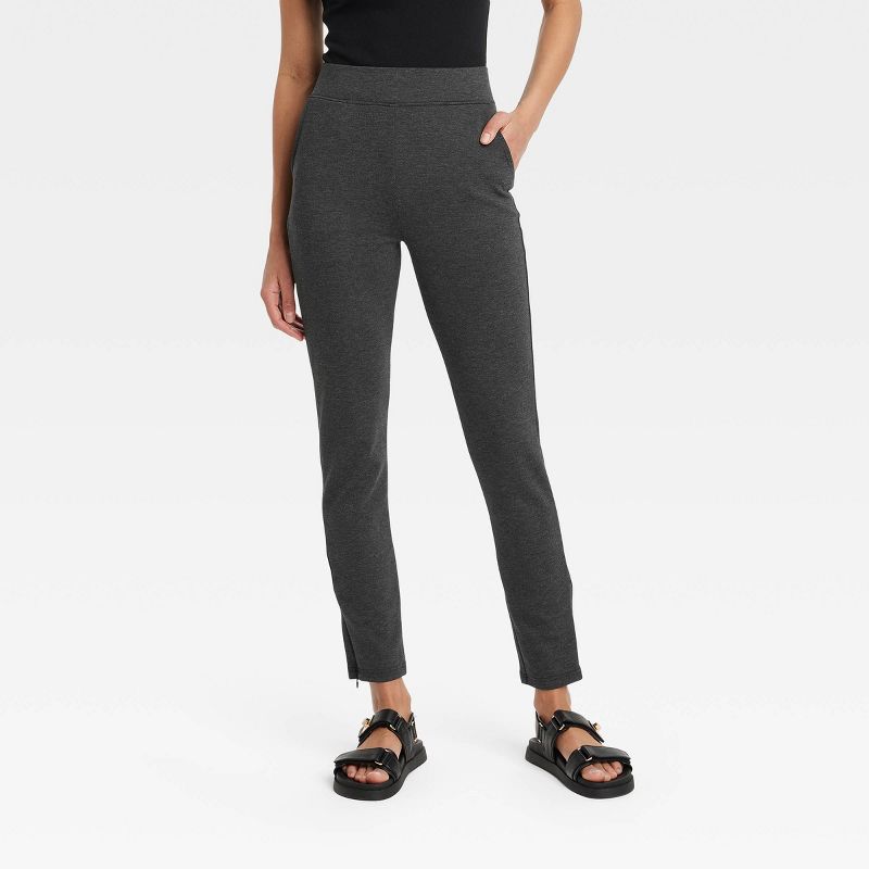 Women's High Waisted Ponte Leggings with Pockets and Side Zipper Split Hem - A New Day™ Black Heather, 1 of 8
