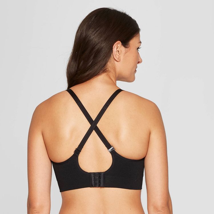 A black colored bra with crisscross straps and a hook closure at the back.