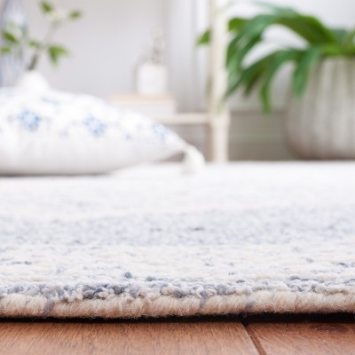 Ivory and Blue Handmade Wool Tufted 6' x 9' Abstract Rug