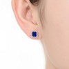 Elegant square stud earring featuring a central cubic zirconia stone surrounded by dazzling accents - 2 of 2
