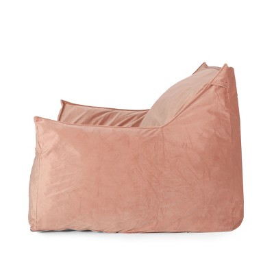 Side view of peach velvet bean bag chair