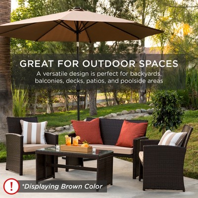 4-Piece Brown Wicker Patio Conversation Set with Beige Cushions and Glass Table