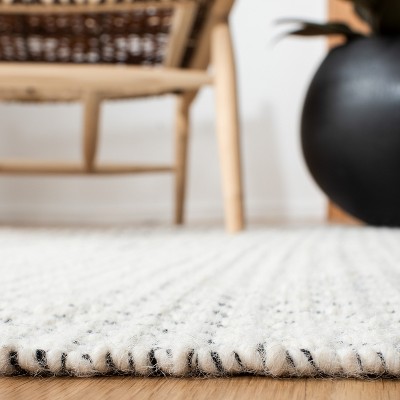 Handwoven Black and Ivory Cotton-Wool Blend Ikat Area Rug