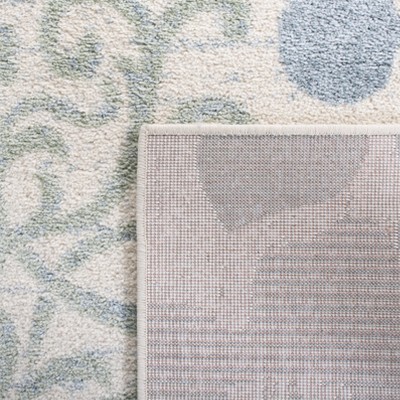Ivory and Blue Floral Synthetic 6' x 9' Area Rug