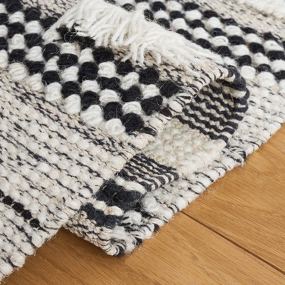 Handmade Black and Ivory Wool Flat Woven Area Rug