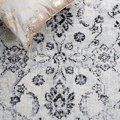 Ivory and Black Synthetic Round Area Rug
