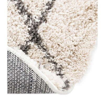 4' x 6' Oval Ivory Geometric Shag Synthetic Area Rug