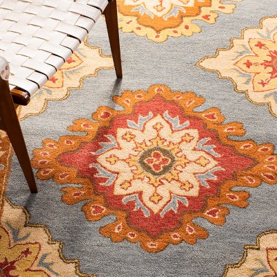Hand-Tufted Blue and Rust Wool 5' x 8' Area Rug