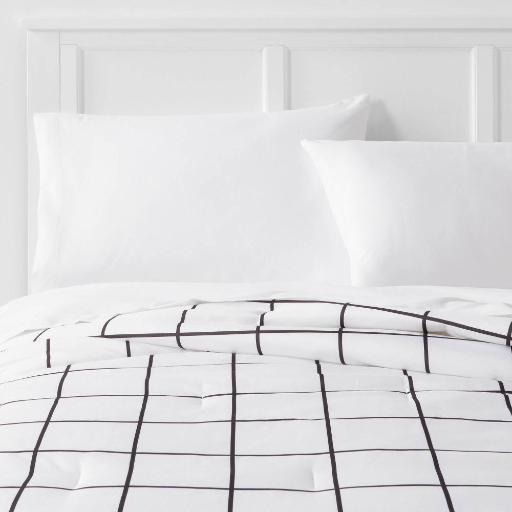 Twin/Twin Extra Long Reversible Microfiber Grid Comforter White/Black - Room Essentials